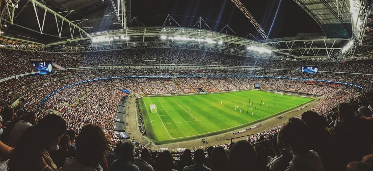 Panoramic view of a stadium at a full football match